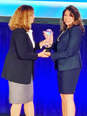 Aprilyn receiving award